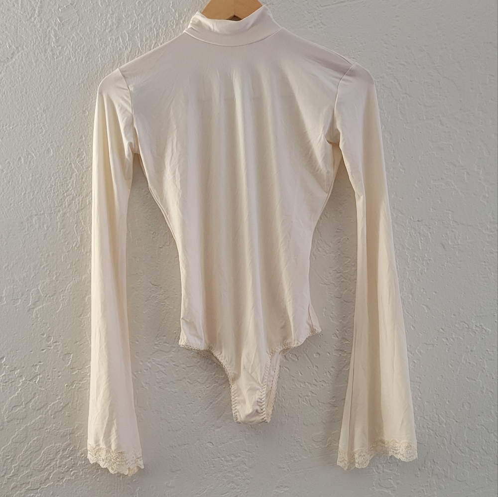 We are HAH Bell Sleeve Bodysuit with Open Back Size Medium